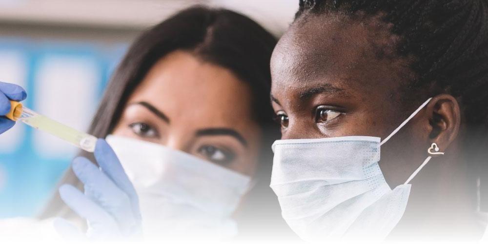 two students in lab with masks on