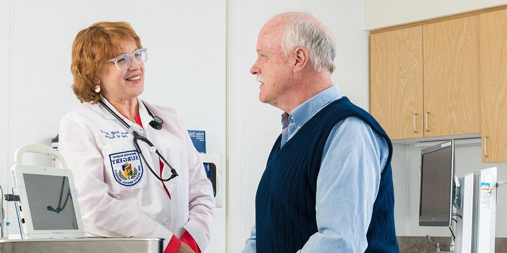 Dr. Karen Schiff, NP, C with patient in her office.